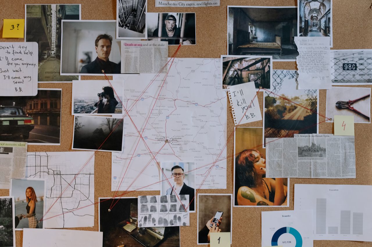 A detailed crime investigation board filled with photos, maps, and red strings connecting clues and evidence.